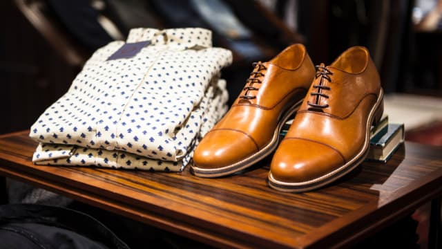 What Does the Rating Downgrade Signal for Designer Brands?